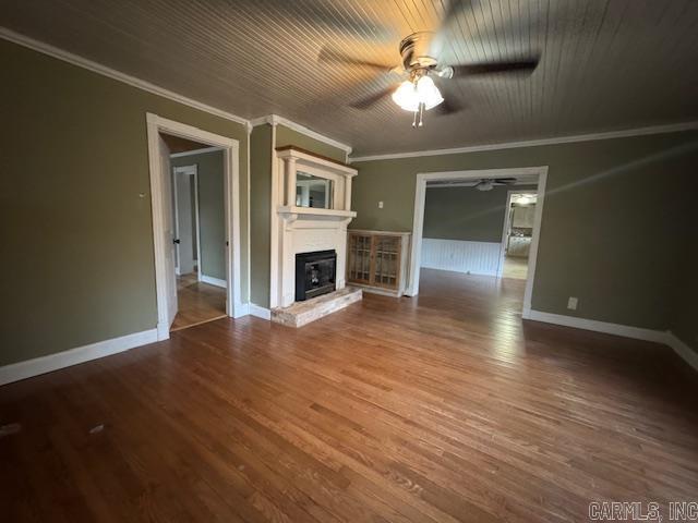 unfurnished living room with ceiling fan, hardwood / wood-style floors, and ornamental molding