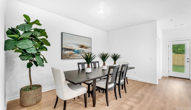 dining space featuring light wood-type flooring