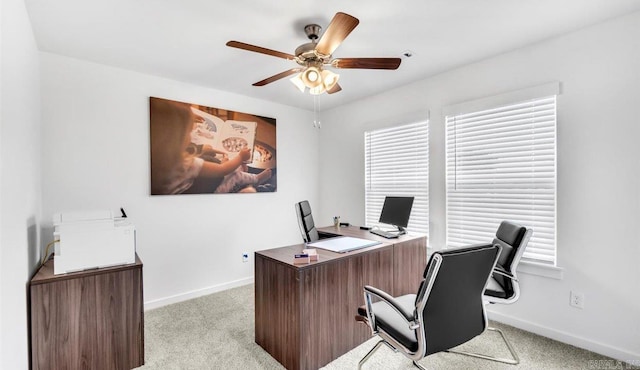 home office with ceiling fan and light colored carpet