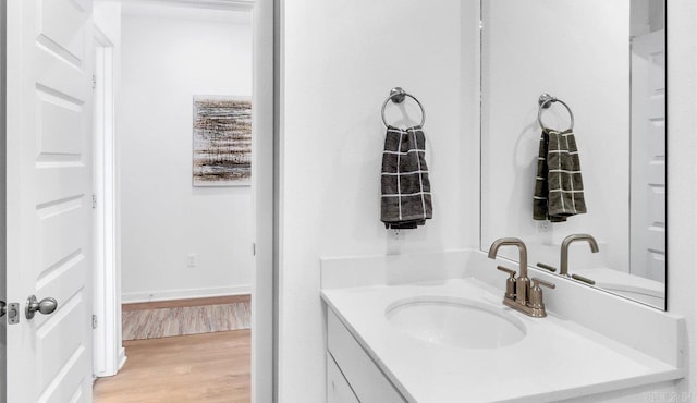 bathroom featuring vanity and hardwood / wood-style flooring