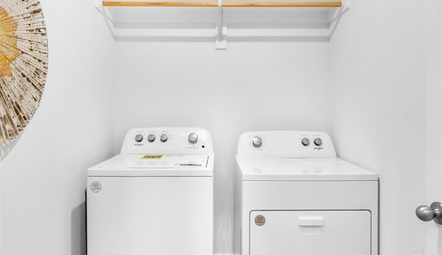 washroom featuring independent washer and dryer