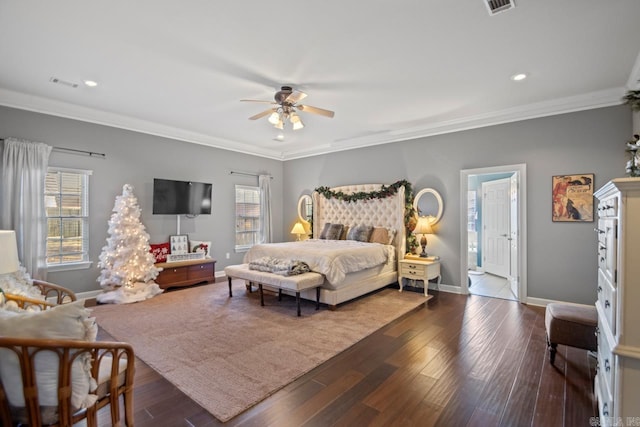 bedroom featuring ceiling fan, dark hardwood / wood-style floors, and crown molding