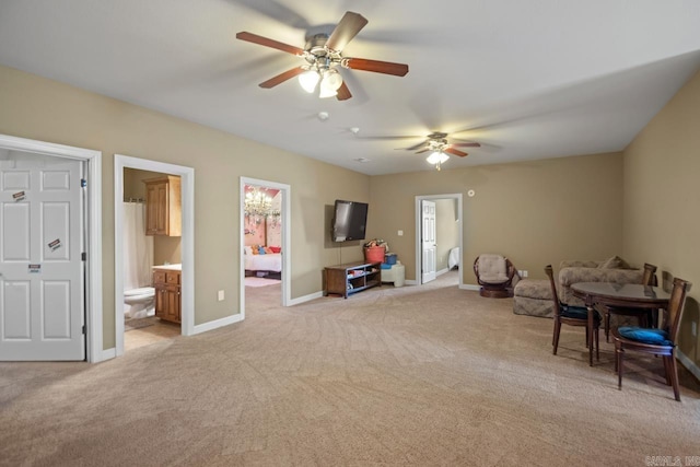 sitting room featuring ceiling fan and light colored carpet