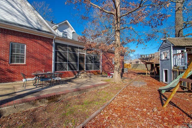 view of yard with a patio area and a playground