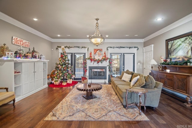 living room featuring french doors, dark hardwood / wood-style flooring, and ornamental molding