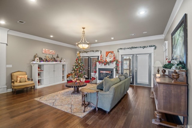 living room featuring dark hardwood / wood-style floors and ornamental molding