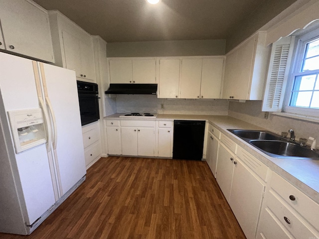 kitchen featuring white cabinetry, sink, and black appliances