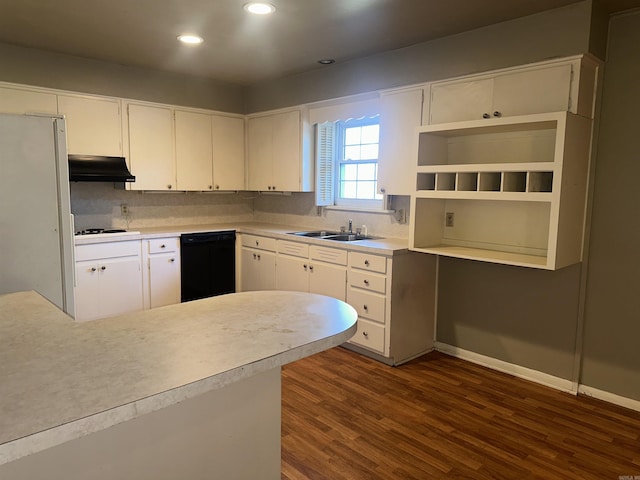 kitchen with white cabinetry, sink, dark hardwood / wood-style flooring, kitchen peninsula, and white appliances