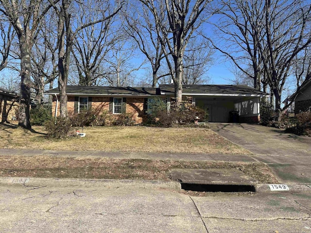 ranch-style home featuring a carport