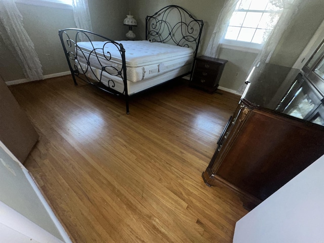 bedroom featuring wood-type flooring