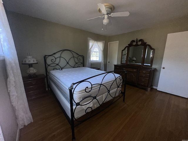 bedroom featuring ceiling fan and dark hardwood / wood-style floors