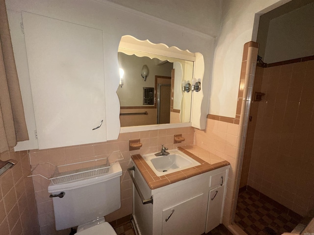 bathroom with tasteful backsplash, vanity, tile walls, and toilet