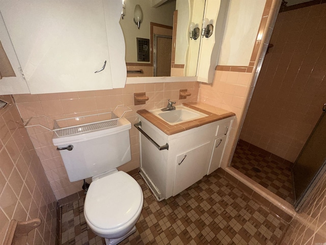 bathroom featuring vanity, decorative backsplash, toilet, tile walls, and walk in shower