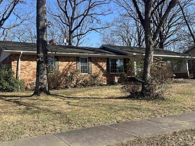 view of property exterior with a lawn