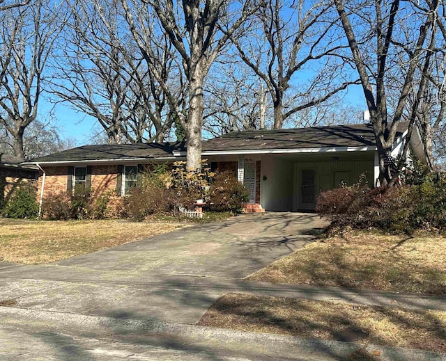 ranch-style house featuring a carport