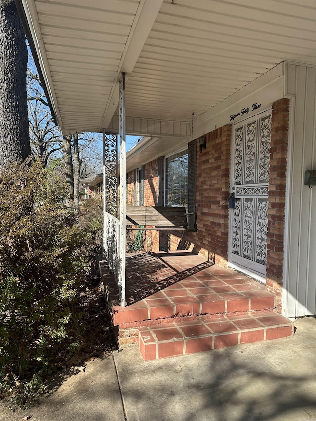 view of patio featuring a porch