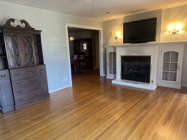 unfurnished living room featuring hardwood / wood-style floors