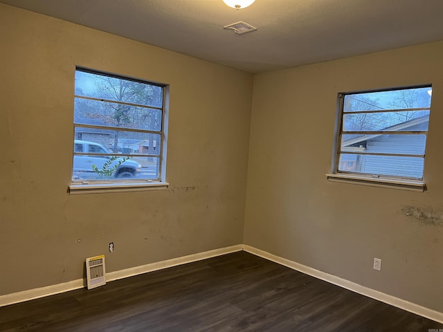 empty room featuring dark hardwood / wood-style floors