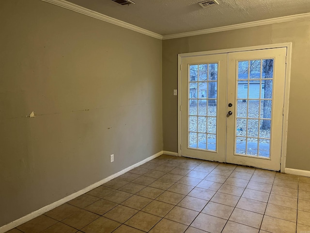 entryway featuring french doors, a textured ceiling, light tile patterned floors, and ornamental molding