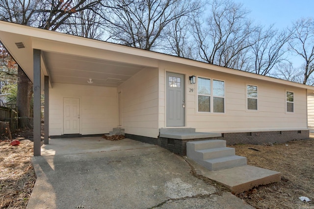 ranch-style home with a carport