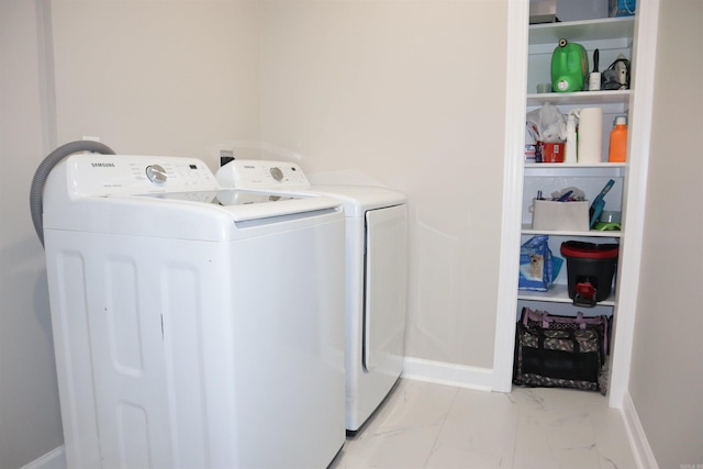 clothes washing area featuring washing machine and dryer