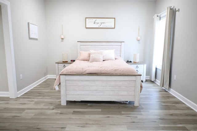 bedroom featuring hardwood / wood-style floors