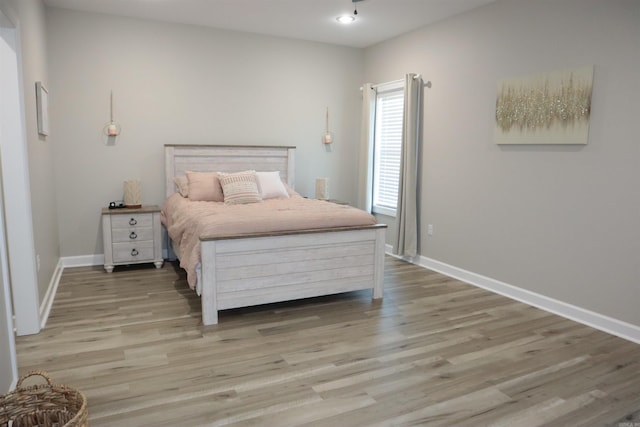 bedroom featuring light wood-type flooring