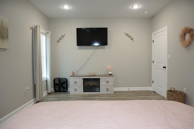 unfurnished bedroom with wood-type flooring