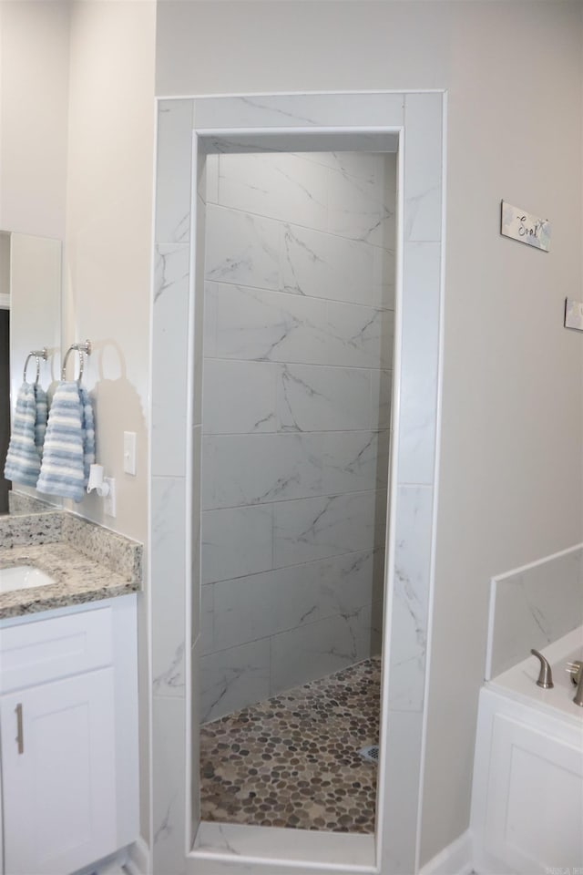 bathroom featuring shower with separate bathtub and vanity