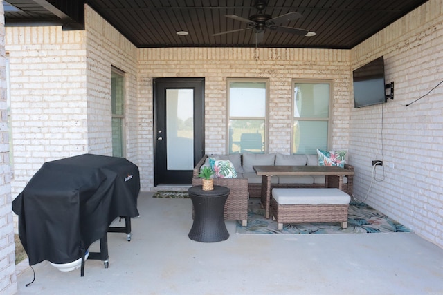 view of patio / terrace featuring ceiling fan, an outdoor living space, and grilling area