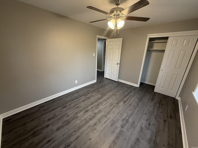 unfurnished bedroom featuring a closet, ceiling fan, and dark hardwood / wood-style flooring