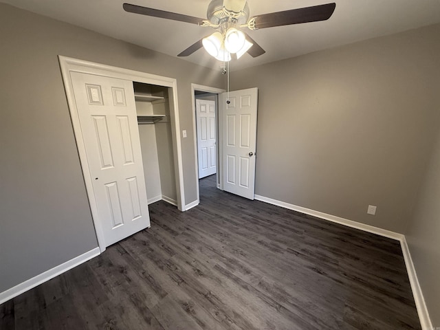 unfurnished bedroom featuring a closet, ceiling fan, and dark wood-type flooring