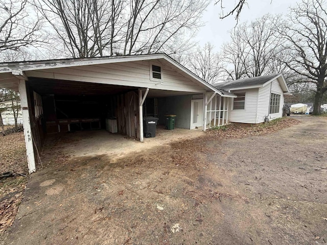 view of side of property featuring a carport