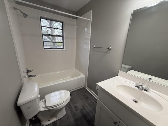 full bathroom with shower / bath combination, vanity, hardwood / wood-style flooring, and toilet