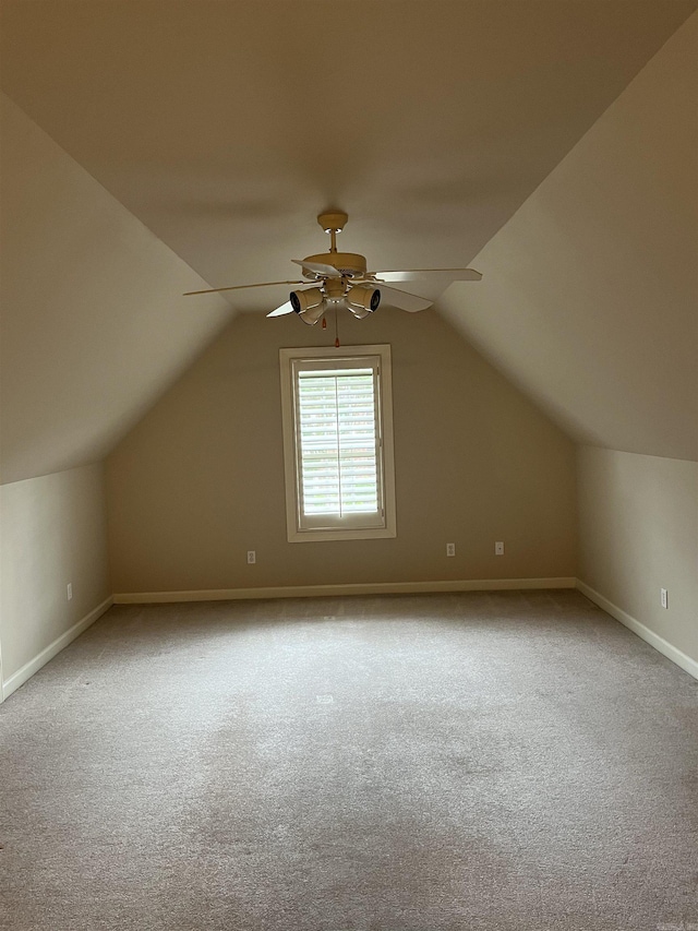 bonus room featuring ceiling fan, carpet floors, and lofted ceiling