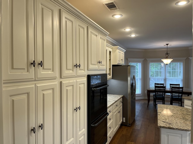 kitchen with stainless steel refrigerator with ice dispenser, dark hardwood / wood-style flooring, light stone counters, ornamental molding, and pendant lighting