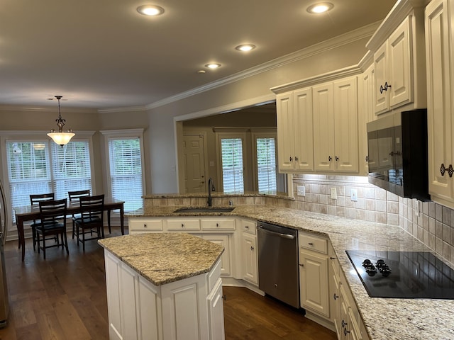 kitchen featuring dishwasher, black electric stovetop, sink, hanging light fixtures, and light stone counters