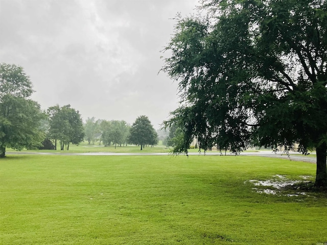 view of home's community featuring a lawn