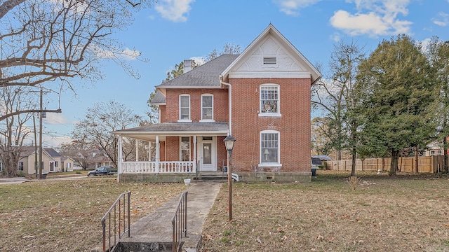 view of front of home featuring a porch and a front lawn