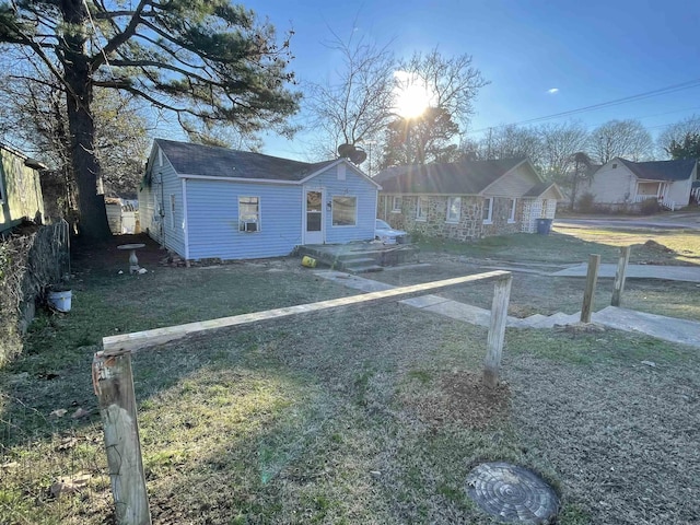 bungalow-style home with a front lawn