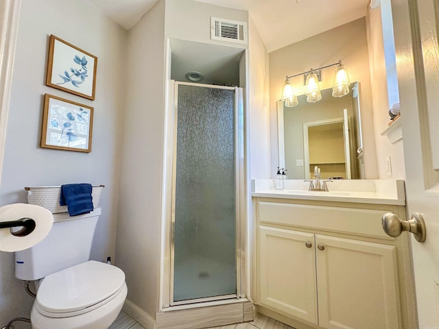 bathroom featuring vanity, an enclosed shower, and toilet