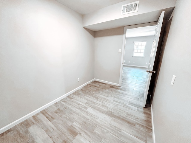 spare room featuring light wood-type flooring