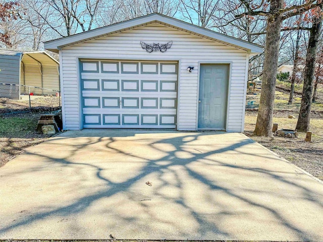 garage featuring a carport