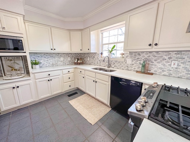 kitchen featuring dishwasher, decorative backsplash, range, and sink