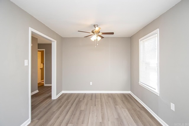 unfurnished room with light hardwood / wood-style flooring and ceiling fan