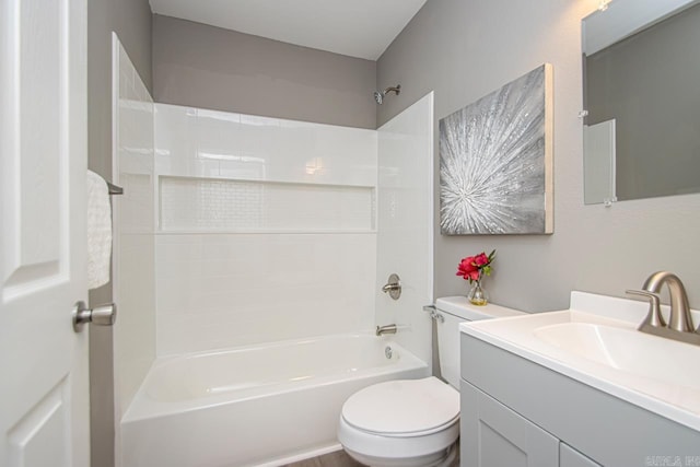 full bathroom featuring vanity, toilet, and washtub / shower combination