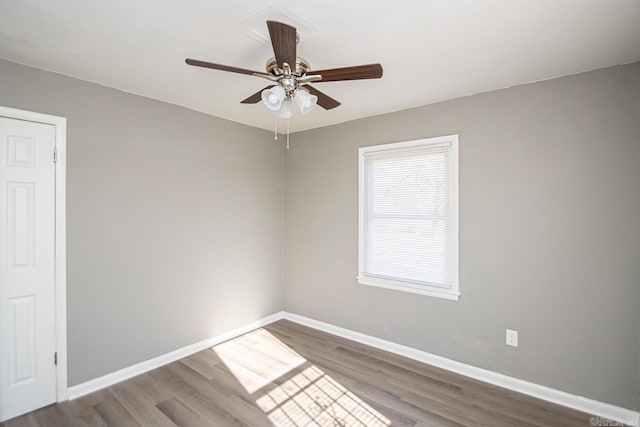 unfurnished room with hardwood / wood-style flooring and ceiling fan