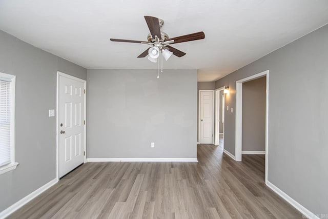 spare room with ceiling fan and light hardwood / wood-style floors