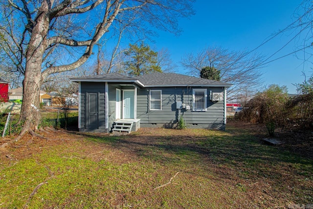 bungalow with a front yard