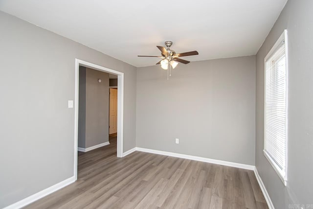 empty room featuring light hardwood / wood-style flooring and ceiling fan